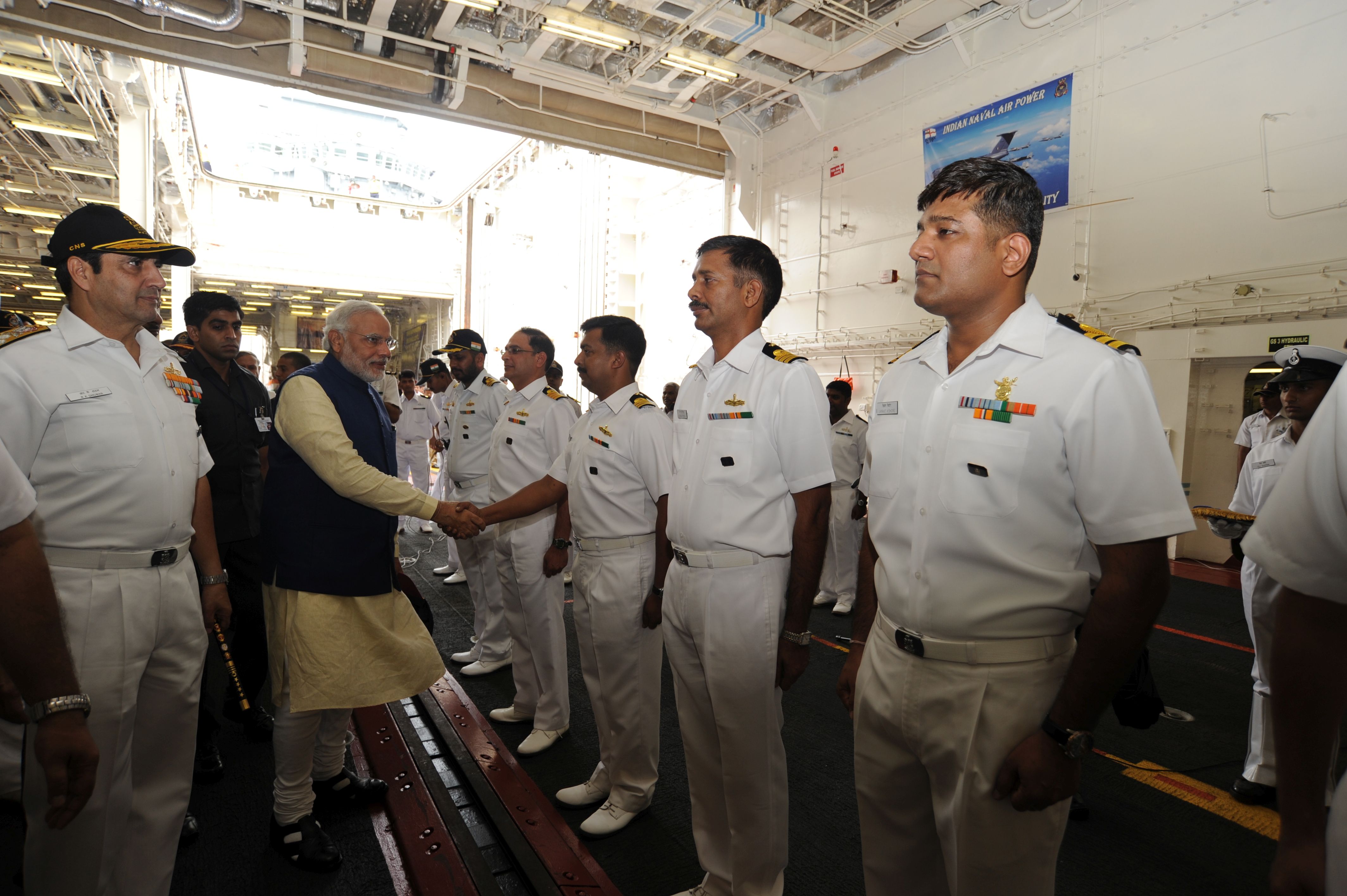 PM greets Naval officers on board INS Vikramaditya